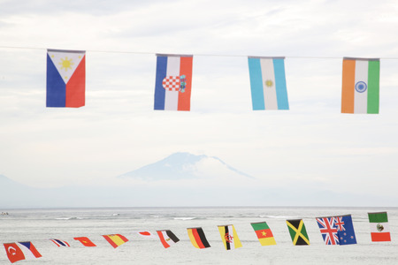 Many different flags against blue skyの写真素材