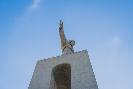 Lisbon Jesus Statue under the blue skyの写真素材