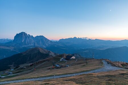 Sunset landscapes in Seceda with clouds and blue sky in Dolomites, South Tyrol, Italy
