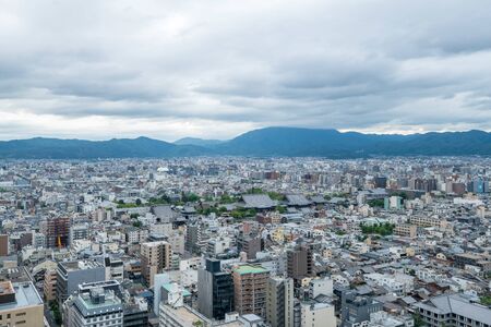 Aerial view of the Kyoto cityscapes during the twilight in a cloudy day, Japanのeditorial素材