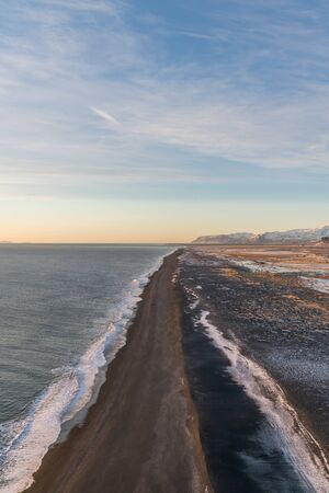 Sunset landscapes in the Black Beach (Reynisfjara Beach) in Iceland