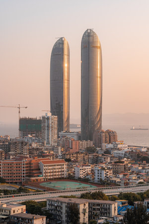 Sunset landscapes of Xiamen city skyline, the famous landmark in Xiamen and downtown city buildings beside the sea at duskのeditorial素材