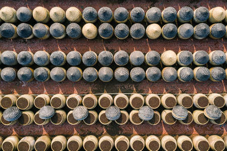 Traditional soy sauce factory, aerial view of the fermented field with numbers of earthen jars on the ground, where soya beans are fermented to produce the soy sauce which is used in Chinese cookingの写真素材