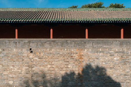 Ancient Chinese building city brick wall with red walls and pillars, in the Temple of Heaven in Beijing, Chinaのeditorial素材