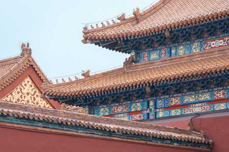 The ancient buildings with red wall, yellow or gray tile roof, door gate in the Forbidden City, Beijing, Chinaのeditorial素材