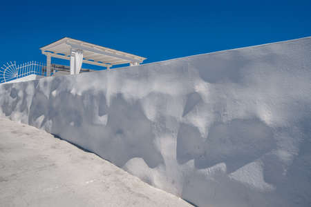 Traditional white buildings and rooftops in the villages of Santorini Island in Greeceの写真素材