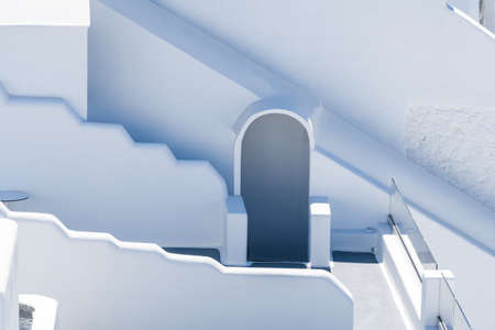 Retro style colorful wooden door and wall backgrounds of traditional Greek Island buildingsの写真素材