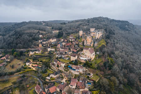Aerial view of an ancient medieval French village and Castelnaud-la-Chapelle Castle on the mountain in Franceのeditorial素材