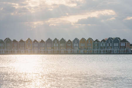 Colorful houses beside the lake at dusk in Houten, Utrecht, Nehterlandsの写真素材