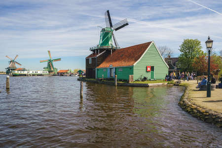 Historical buildings and windmills at dawn in Zaanse Schans, Netherlandsのeditorial素材