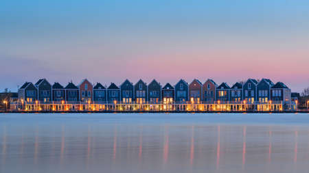 Colorful houses beside the lake at dusk in Houten, Utrecht, Nehterlands