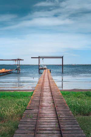 Wooden piers and boats for the oyster farm in Etang de Thau in South Franceの写真素材