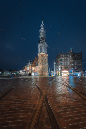 Evening panoramic view of the famous historic center with lights, bridges, canals and traditional Dutch houses in Amsterdam, Netherlandsの写真素材