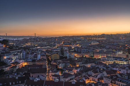 City skyline of the old Alfama district in Lisbon at duskの写真素材