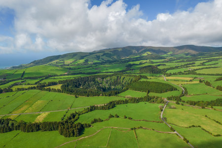 Aerial view of the landscapes on Sao Miguel Island, green farmland and volcanic mountains and lakes, Azores, Portugalの写真素材