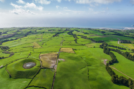 Aerial view of the landscapes on Sao Miguel Island, green farmland and volcanic mountains and lakes, Azores, Portugalの写真素材