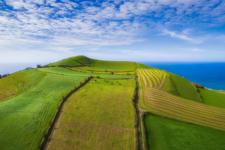 Aerial view of the landscapes on Sao Miguel Island, green farmland and volcanic mountains and lakes, Azores, Portugalの写真素材