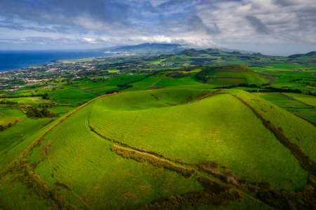 Aerial view of the landscapes on Sao Miguel Island, green farmland and volcanic mountains and lakes, Azores, Portugalの写真素材