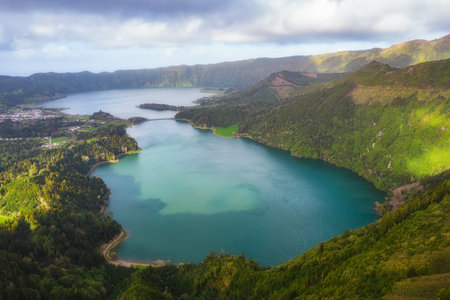 Aerial view of the volcanic mountains and lakes, with green farmland of Sete Cidades on Sao Miguel Island, Azores, Portugalの写真素材