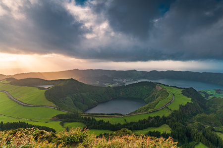 Aerial view of the volcanic mountains and lakes, with green farmland of Sete Cidades on Sao Miguel Island, Azores, Portugalの写真素材