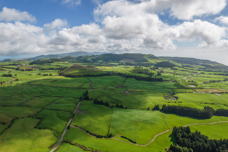 Aerial view of the landscapes on Sao Miguel Island, green farmland and volcanic mountains and lakes, Azores, Portugalの写真素材