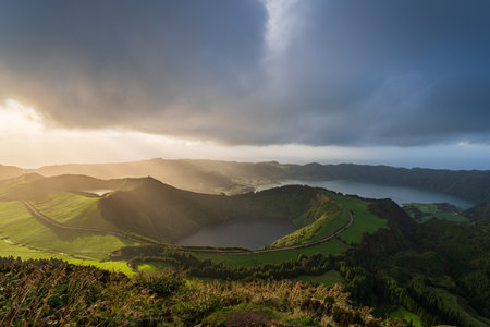 Aerial view of the volcanic mountains and lakes, with green farmland of Sete Cidades on Sao Miguel Island, Azores, Portugalの写真素材