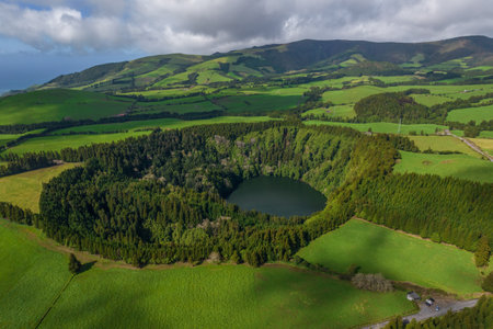 Aerial view of the landscapes on Sao Miguel Island, green farmland and volcanic mountains and lakes, Azores, Portugalの写真素材