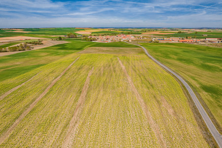 Aerial view of a rural town surrounded by idyllic farmlandの写真素材