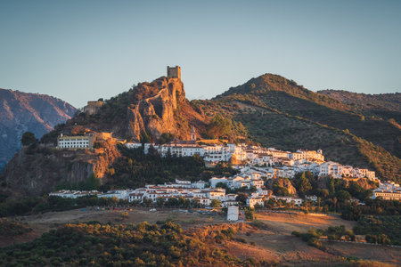 Sunset landscapes of Zahara de la Sierra, an ancient village on the mountain with an ancient castle in Cadiz, Spainの写真素材