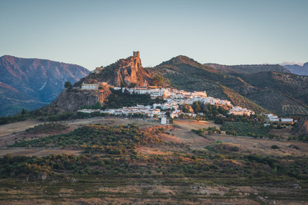 Sunset landscapes of Zahara de la Sierra, an ancient village on the mountain with an ancient castle in Cadiz, Spainの写真素材
