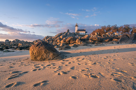 The Pontusval lighthouse with rocky coastline in Brittany, Franceの写真素材