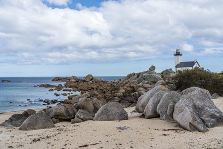 The Pontusval lighthouse with rocky coastline in Brittany, Franceの写真素材