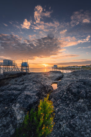 Sunset landscapes at the coastline of Saint-palais-sur-mer, with traditional carrelets along the sea in Charente-Maritime, Franceの写真素材