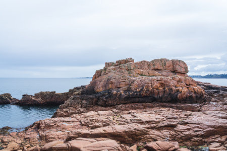Natural landscape of the rocky beach and seascape along the Brittany coastline, CÃ´te de granite rose or Pink Granite Coast in Franceの写真素材