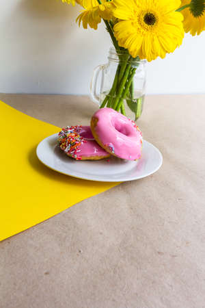Yellow gerbera flowers bunch on yellow backgroundの写真素材