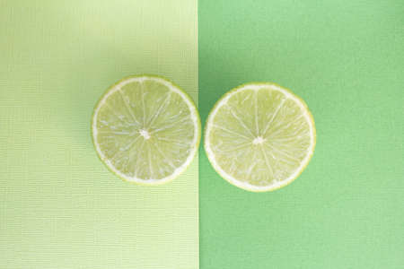 One fresh green lime overhead view lemon backgroundの写真素材