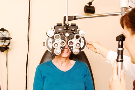 Close up of senior having eye examination at optometry clinic