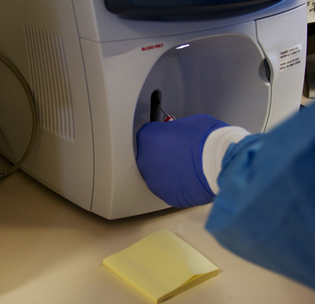 Laboratory staff testing for patient blood gases