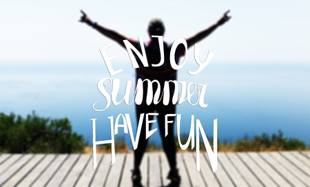 Hand written lettering composition.Phrase Enjoy Summer Have Fun. Wooden pier, the sea and human silhouette.の写真素材