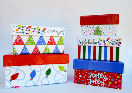 Decorative Stacking Christmas Gift Boxes with Christmas trees and Christmas lights on them in white,...