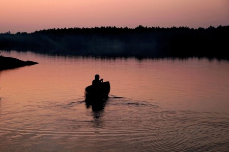 Canoe solo after sunsetの写真素材