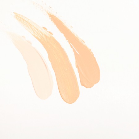 Foundation cream drops and smears of different shades for different skin types. Cosmetics and...
