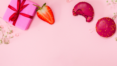 Cute pink flat lay, template with free space in the center for your design. Glamorous style, elements cosmetics and sweets on frameの写真素材