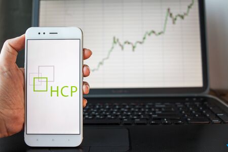 SAINT PETERSBURG, RUSSIA - JUNE 25, 2019: HCP Company logo smartphone screen. background of stock...