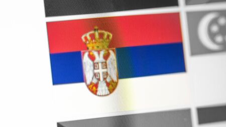 Serbia national flag of country. Serbia flag on the display, a digital moire effect. News of...