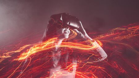 girl playing VR games, concept of modern technology, effect of double exposure. A young cheerful...