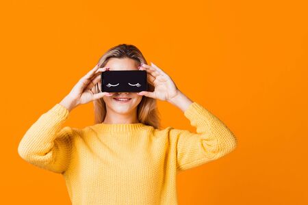 Digital detox, the icon of closed eyes on the smartphone screen, applications that help to observe...