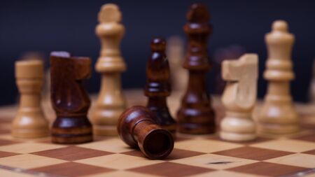 Chess game, check or checkmate, cut a figure, the concept of competition in business. Black and...