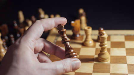 Chess game, check or checkmate, cut a figure, the concept of competition in business. player's hand...