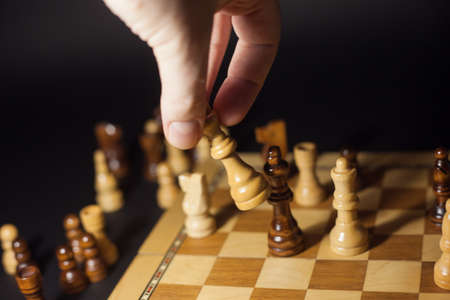 Chess game, check or checkmate, cut a figure, the concept of competition in business. player's hand...